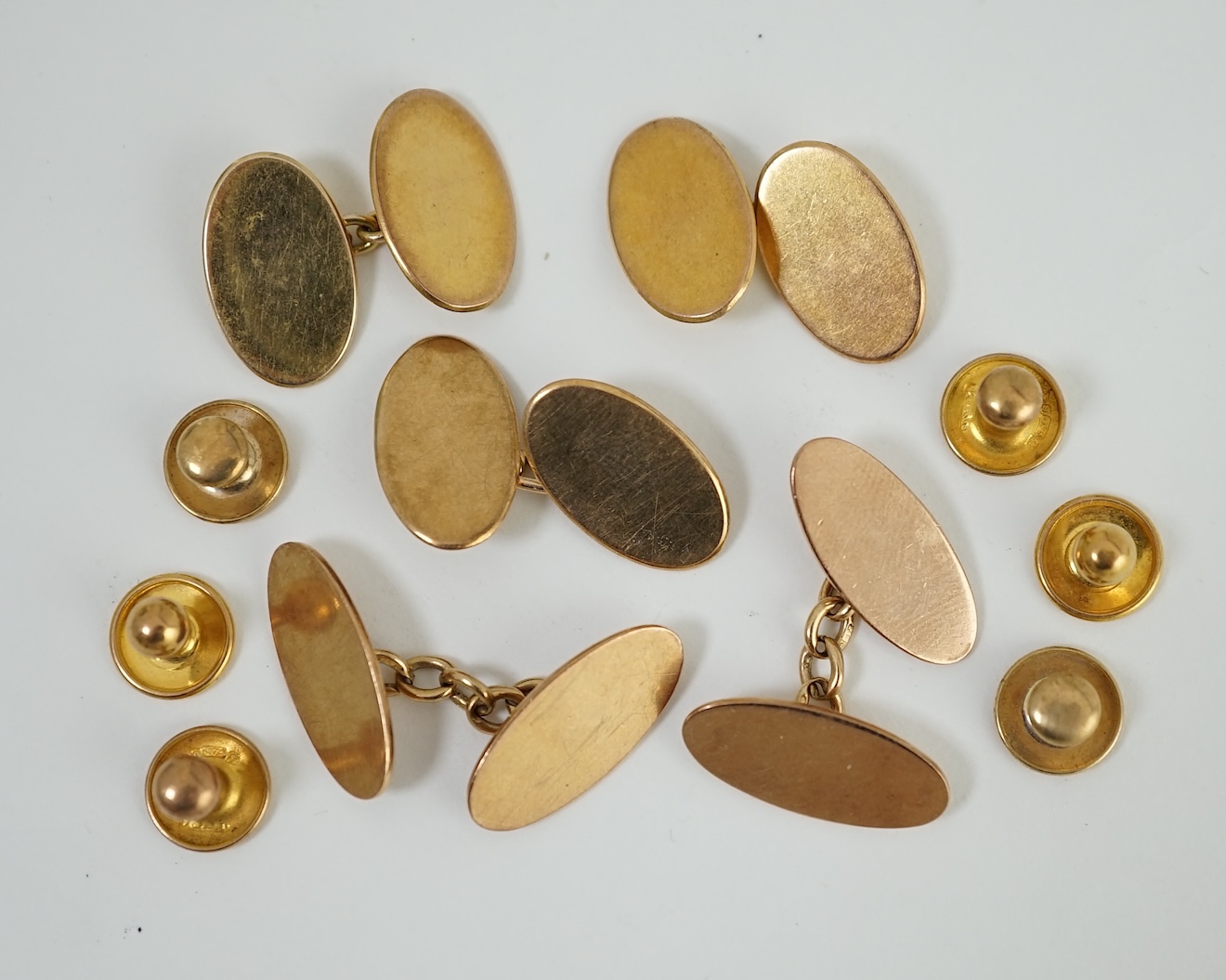 Two pairs of 9ct gold oval cufflinks, one other 9ct gold cufflink and six assorted 9ct dress studs